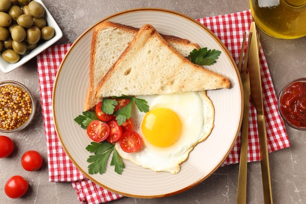 Concept of tasty breakfast on gray textured background