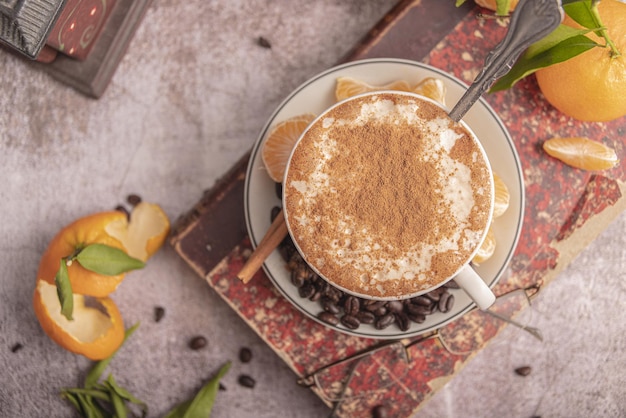 Concept of tasty breakfast with mandarin jam on white textured table.