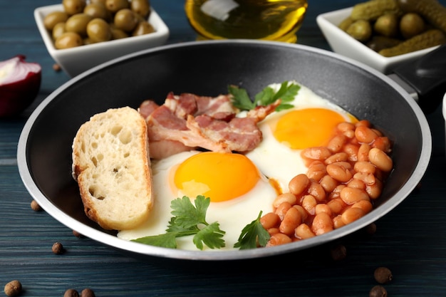 Concept of tasty breakfast on wooden background