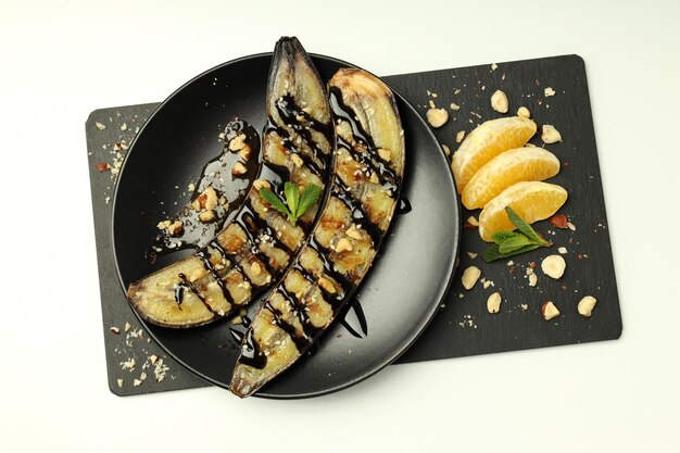 Concept of tasty dessert with grilled banana top view