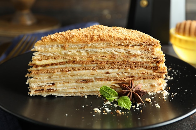 Concept of tasty dessert with honey cake, close up