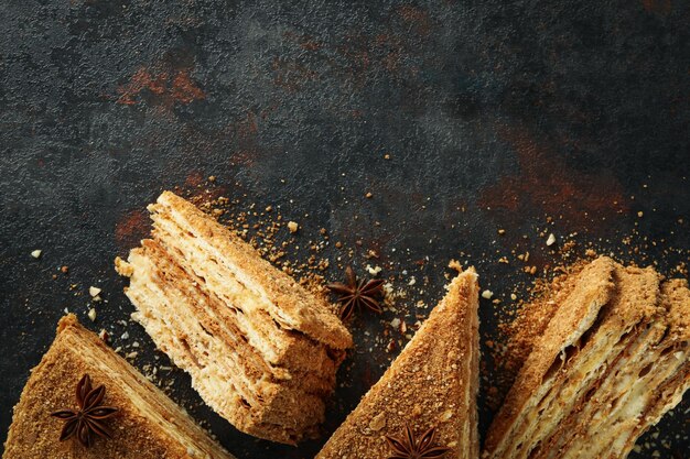 Concept of tasty dessert with honey cake space for text