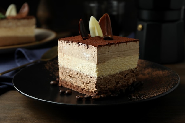 Concept of tasty dessert with Tiramisu cake close up