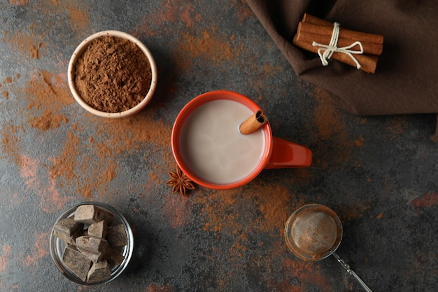 Concept of tasty drink with cocoa on dark background