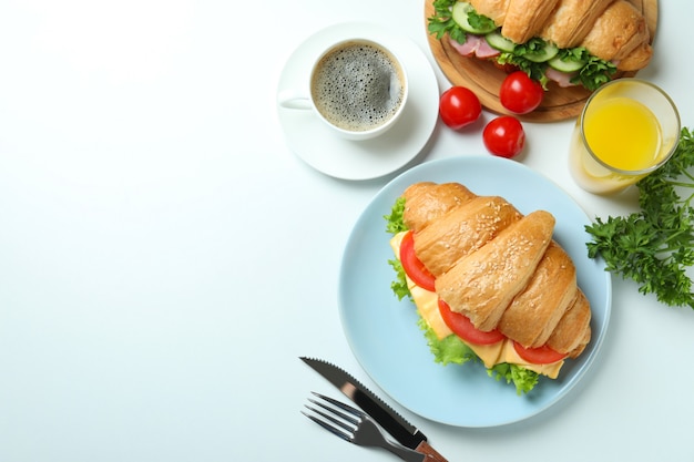 Concept of tasty eating with croissant sandwich