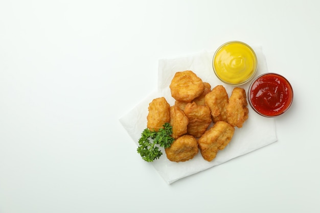 Concept of tasty eating with fried chicken on white background