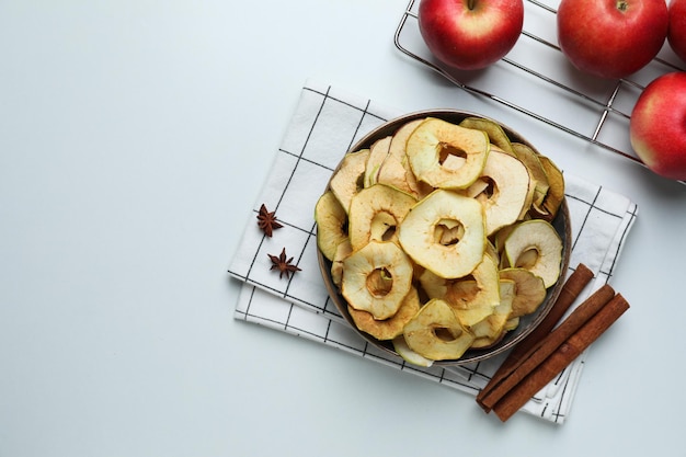 Concept of tasty food dried apple chips space for text