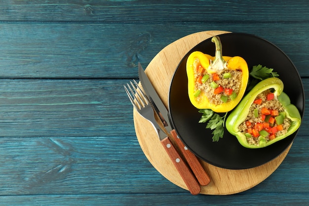 Concept of tasty food with Ã¢ÂÂstuffed pepper on wooden background