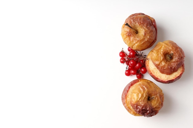 Concept of tasty food with baked apple on white background