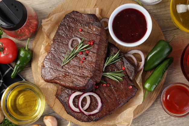 Concept of tasty food with beef steaks, top view