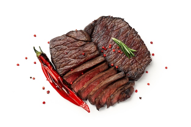 Concept of tasty food with beef steaks on white background