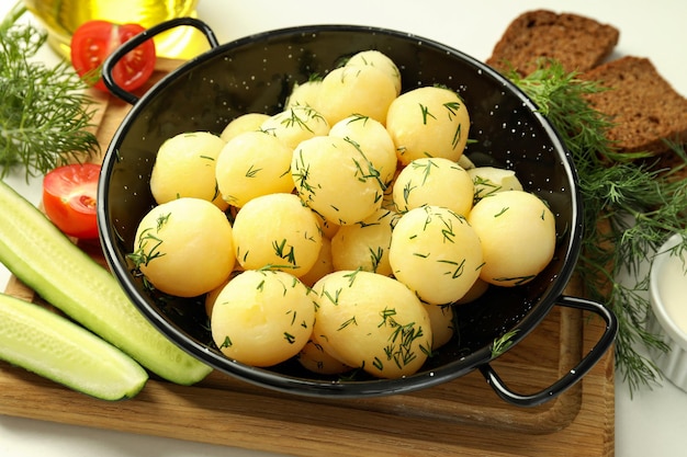 Concept of tasty food with boiled young potatoes close up