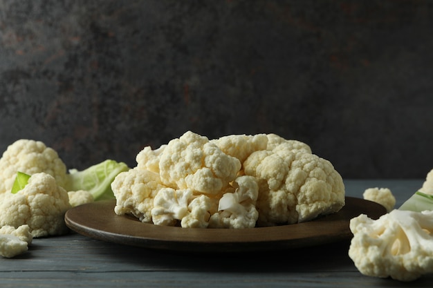 Concept of tasty food with cauliflower on wooden table