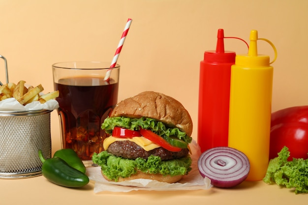 Concept of tasty food with delicious burger