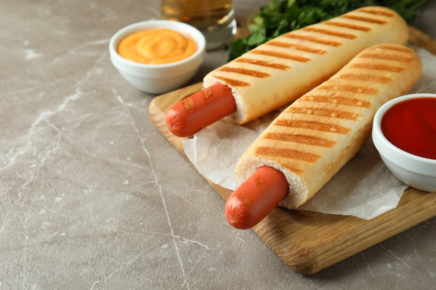 Concept of tasty food with french hot dog