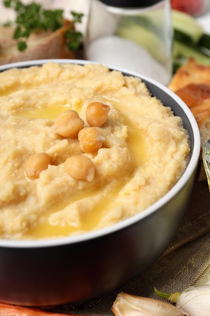 Concept of tasty food with hummus close up