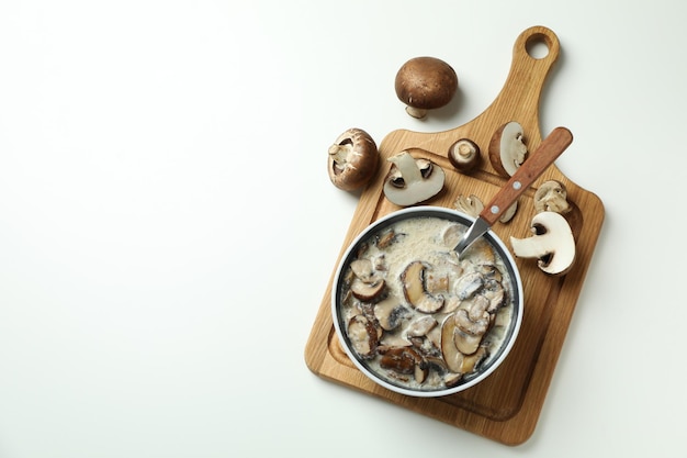 Concept of tasty food with mushroom sauce on white background