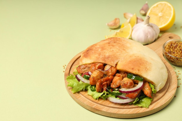 Concept of tasty food with pita with chicken space for text