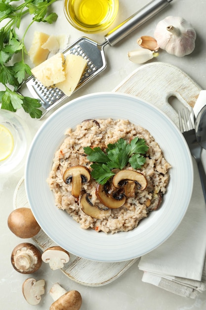 Concept of tasty food with risotto with mushrooms, top view