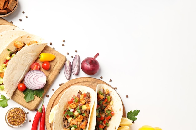 Concept of tasty food with taco on white background