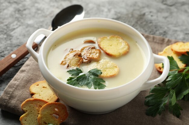 Concept of tasty lunch with bowl of mushroom soup