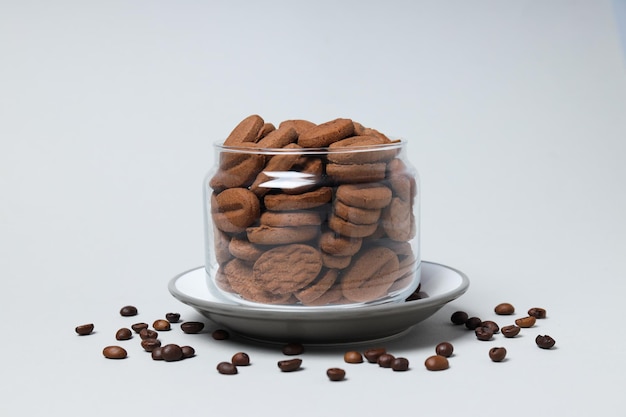 Concept of tasty snack for hot drink cookies in the shape of coffee seeds