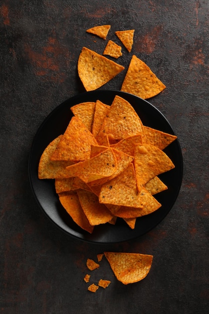 Concept of tasty snacks corn chips top view