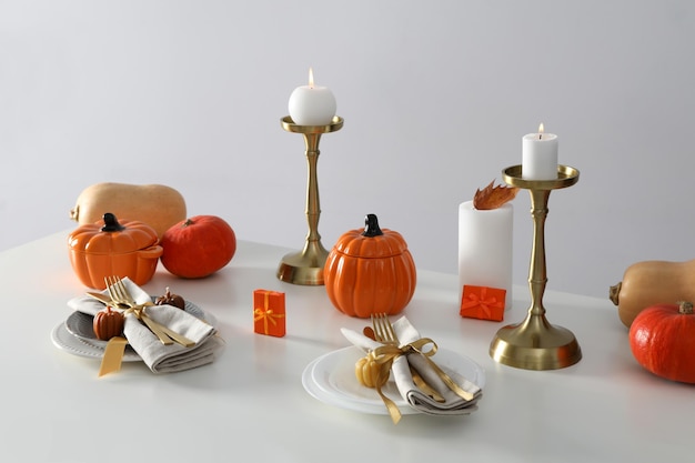 Concept of Thanksgiving day Autumn table setting on white table