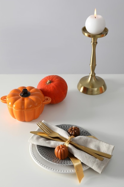 Concept of Thanksgiving day Autumn table setting on white table