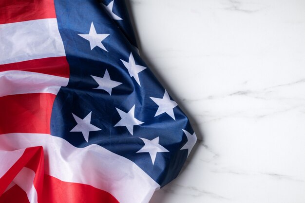 Concept of U.S Independence day or Memorial day. National flag over bright marble table background.