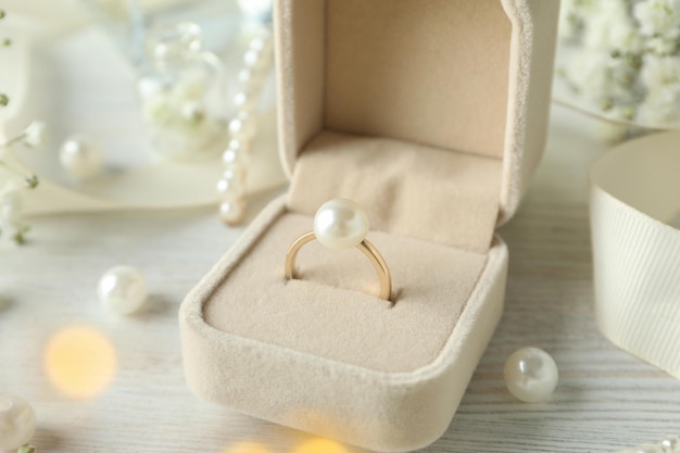 Concept of wedding accessories with wedding ring, close up