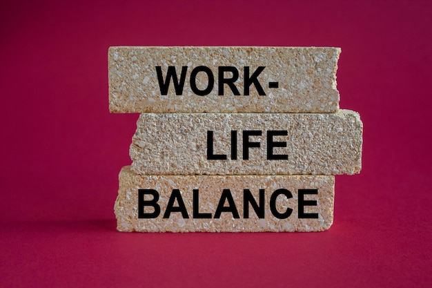 Concept words work life balance on brick blocks Beautiful pink background