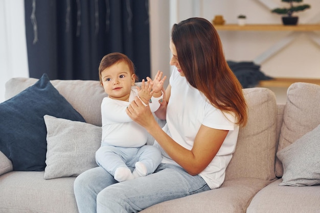 Conception of parenting Mother with her little daughter is at home together