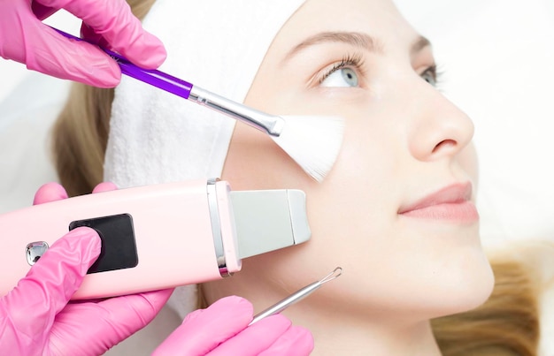 A conceptual image of the beauty and cosmetology of the hands of several cosmetologists holding the appropriate equipment The concept of beauty The concept of cosmetology