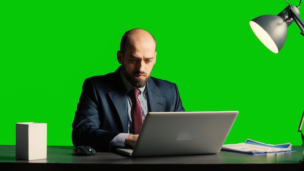 Concerned person making mistake over greenscreen, feeling angry about business fail. Corporate employee working under pressure on isolated mockup copyspace, blank chroma key background.