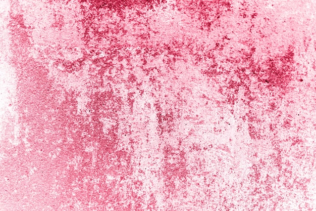 Concrete background texture of old dirty pink concrete stone wall as backdrop grunge grey cement surface like structure paper material close up toned in viva magenta trend color of the year 2023