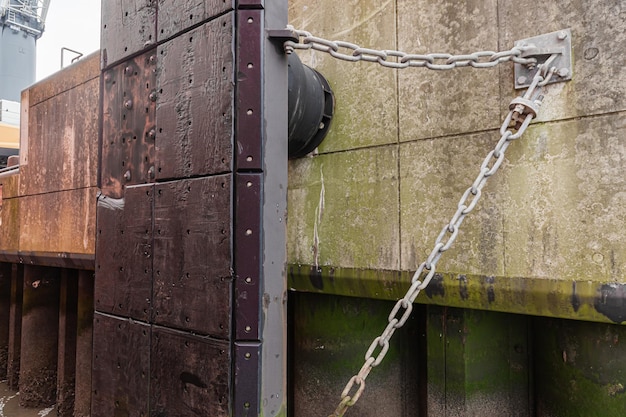 Concrete berth of the seaport with a fender to protect the ship's hull