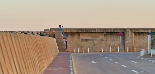 Concrete breakwater in the seaport seen from the front