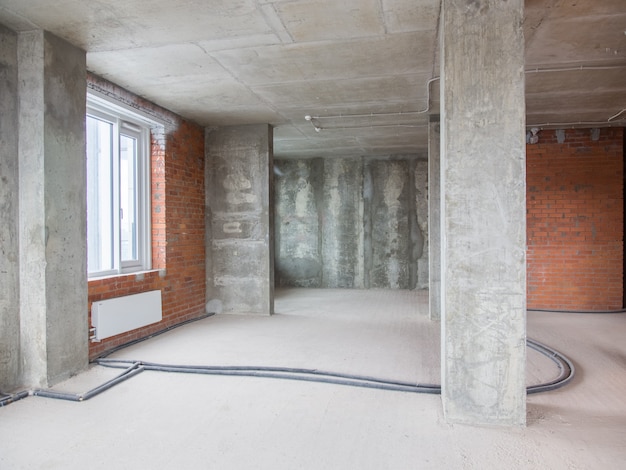 Concrete and brick walls in the apartment for repair