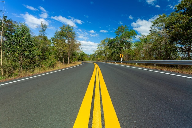 Concrete road with mountains and sky