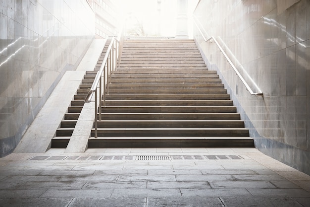 concrete staircase in a dark to up to the street