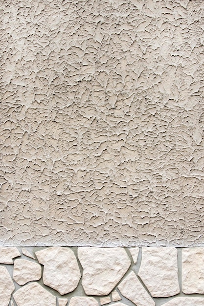 Concrete surface with rough pattern divided diagonally from a large stone surface