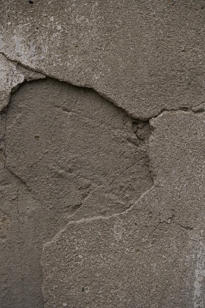 concrete texture close up,small cracks on surface of concrete, which create an interesting structure