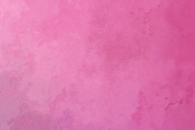 Concrete wall texture painted in pink color. Abstract background