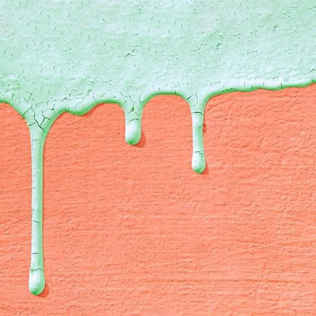 Concrete wall texture with drips of paint.