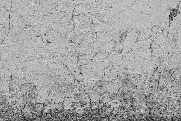 Concrete wall with cracks and scratches 