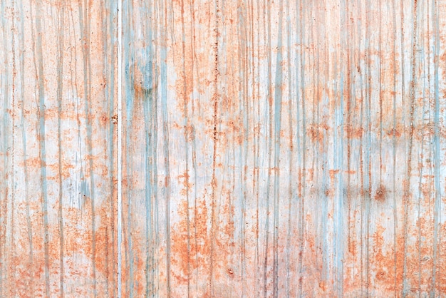 Concrete wall with orange paint streaks