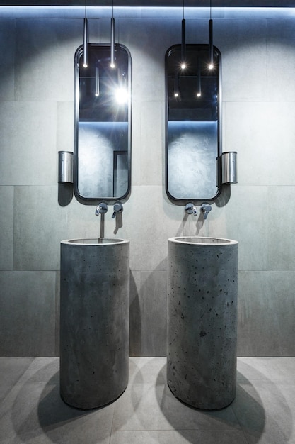 Concrete washbasin in a loft style interior