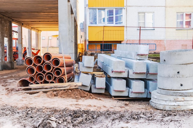 Concrete well rings and slabs at construction site