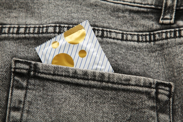 Condom in black jeans pocket Protect yourself use a condom